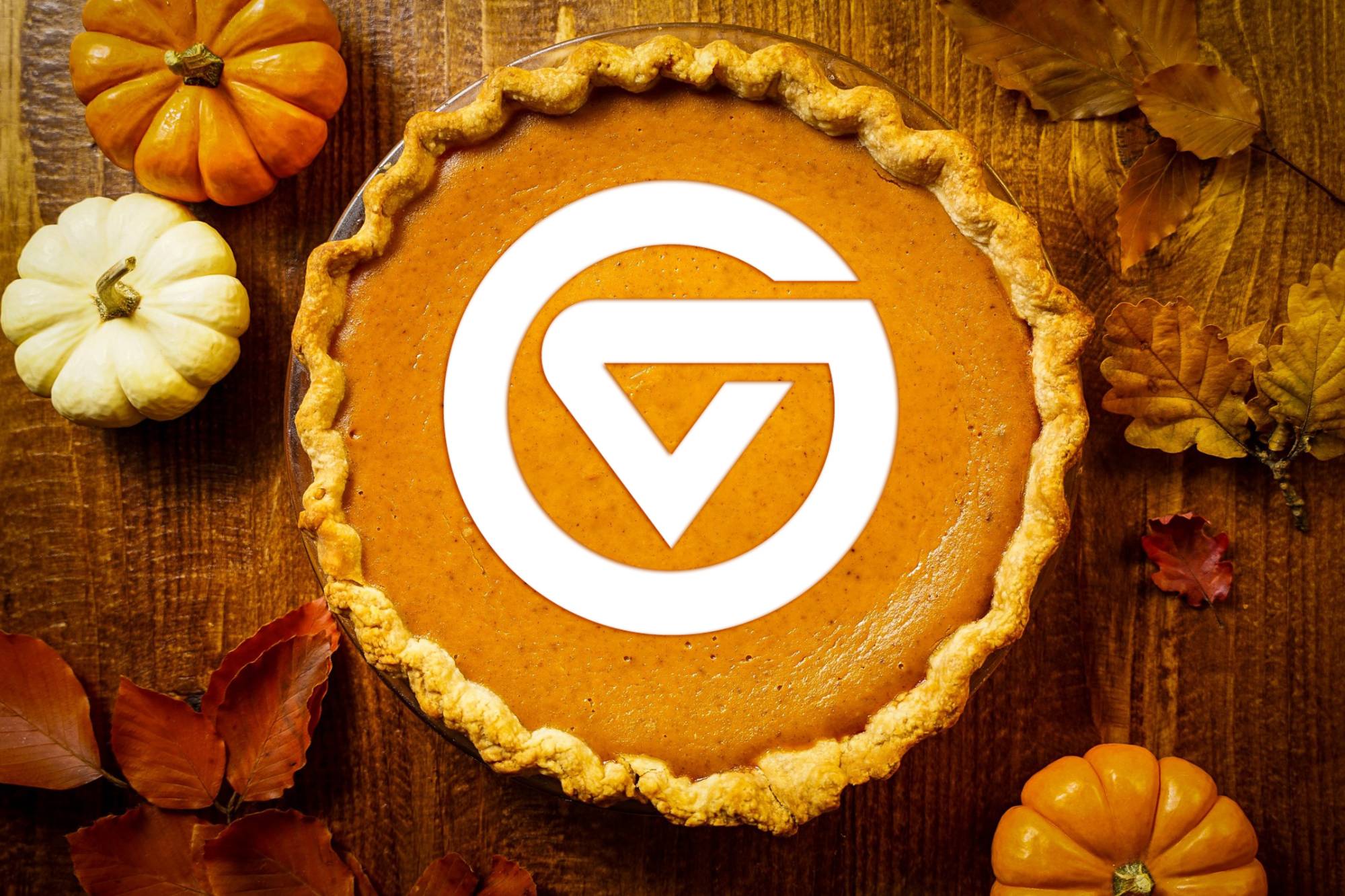 Pumpkin pie with white GV circle logo on it.
